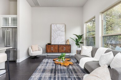 Living area featuring baseboards, visible vents, 