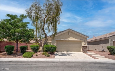 View of front of home featuring a garage, fence, s