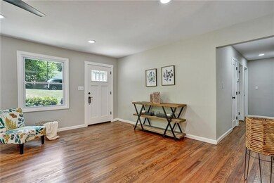 Foyer entrance featuring hardwood / wood-style flo