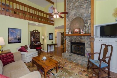 Two-story stone gas fireplace for cozy winter even