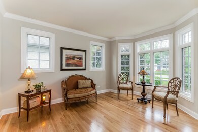 With large bay window and gleaming hardwood floors