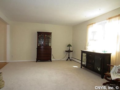 Living Room. Fresh pain and new carpet in this lar