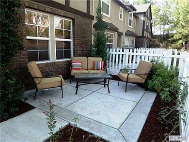 Charming Front Courtyard with White Picket Fence a