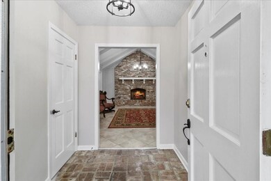 Foyer with brick flooring