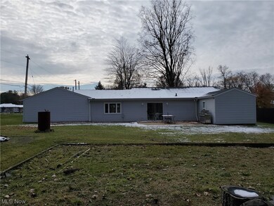 Back of house featuring a patio area and a yard