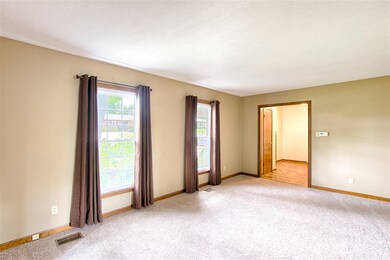 The living room features two south facing window a