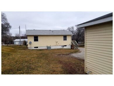 View of back of house and back yard from garage