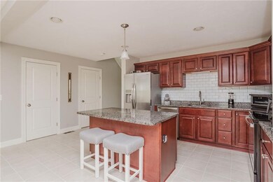 Kitchen with Breakfast Bar,overhead lighting, tile