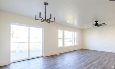 Unfurnished room featuring wood finished floors, recessed lighting, and ceiling fan