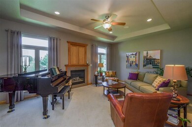 Great room with tray ceiling, gas fireplace, overs