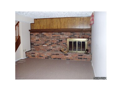 A toasty woodburning fireplace is a cozy plus in t
