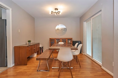 This dining room features beautiful flooring and c
