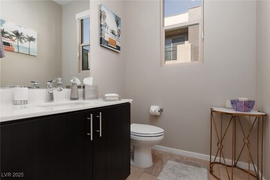 Stylish half-bath with a modern vanity and natural