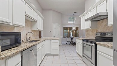 Kitchen featuring appliances with stainless steel 