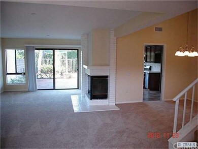 Family room with fireplace and slider to back pati