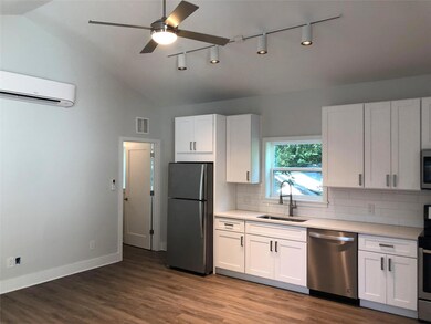 Kitchen with visible vents, appliances with stain
