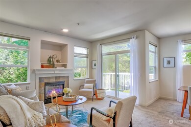 Living room and both bedrooms back up to greenbelt for privacy and evergreen views.