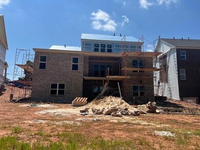 Back of property with brick siding