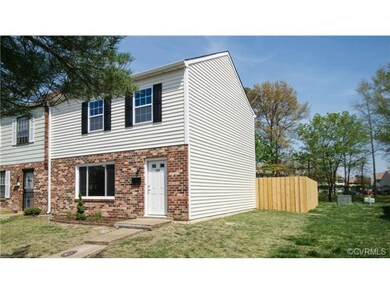 Another view of the exterior front and fenced-in backyard.