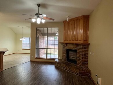 Unfurnished living room featuring hardwood / wood-