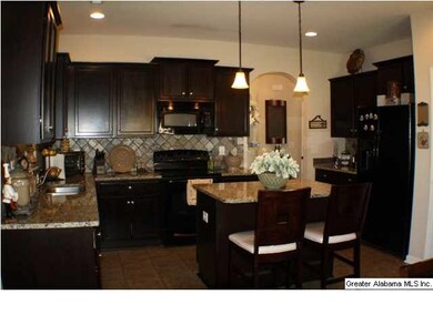 Spacious Kitchen with Black appliances. Granite co