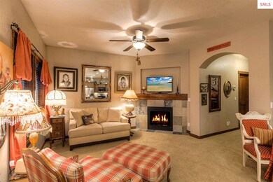 Gas Fireplace, wood mantel, arched openings, abund