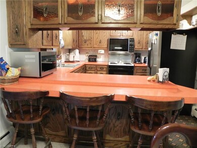 Kitchen features refrigerator, stove, dishwasher, 