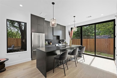 Kitchen featuring light wood-style floors, a cent