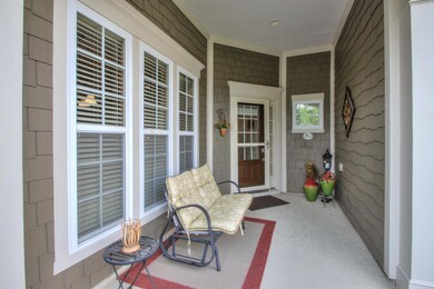 Attractive covered front porch.  Yard sprinkler system, covered front porch and durable storm door. 