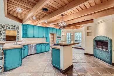 Kitchen with island and fireplace.
