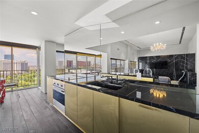 Kitchen with stainless steel oven, wood-type floor