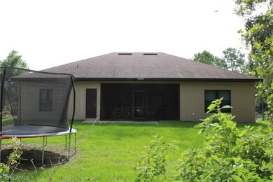 Rear of Home / Screened Lanai under truss.