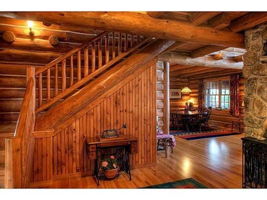 Entry. The foyer, with staircase to...