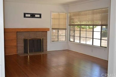 Spacious living room with crown moldings