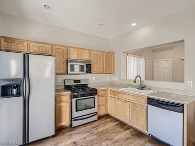 Fully equipped kitchen overlooks the dining area a