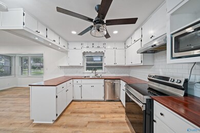 Spacious Kitchen with newly painted cabinets and recessed lighting