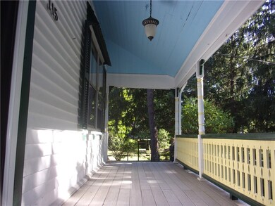 Farmer's Porch/View from left side of dwelling.