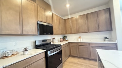 Kitchen featuring appliances with stainless steel