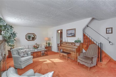 Enter the foyer and proceed into the spacious livi
