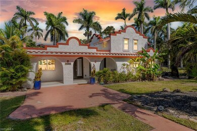 Mediterranean / spanish-style house featuring stucco siding, a front lawn, covered porch, and a tiled roof