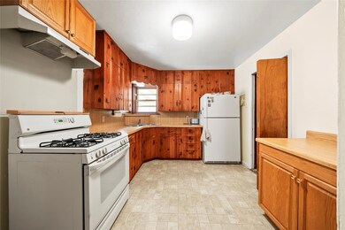 Kitchen featuring sink and white appliances