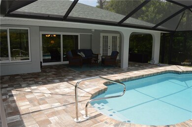 Gorgeous patio and pool area w/ newer pool cage and pool resurfaced.