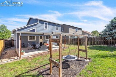 Back of property featuring a patio area and a fenced backyard