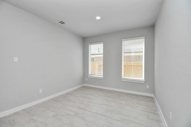 Create lasting memories with your family and friends at the dining table! This expansive dining room showcases sophisticated flooring, custom paint, and seamlessly connects to the family room and kitchen, providing an open and inviting atmosphere. Sample photo of completed home with similar floor plan. Actual colors and selections may vary.
