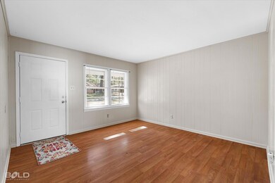 Foyer entrance with hardwood / wood-style floors