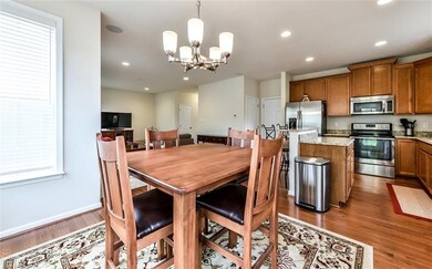 Dining area and gourmet kitchen with stainless ste