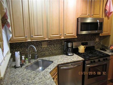 Kitchen. Maple cabinetry with granite counter and 