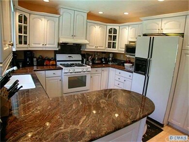 Remodeled kitchen. Canned lights, glass-faced door