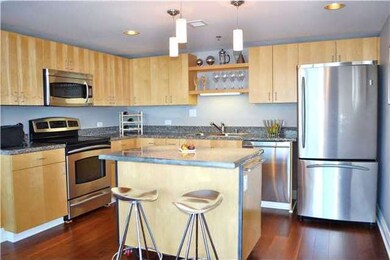 Gourmet kitchen with custom mobile island, granite