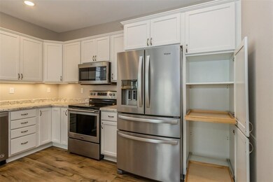 Stainless steel appliances, pantry with roll out s
